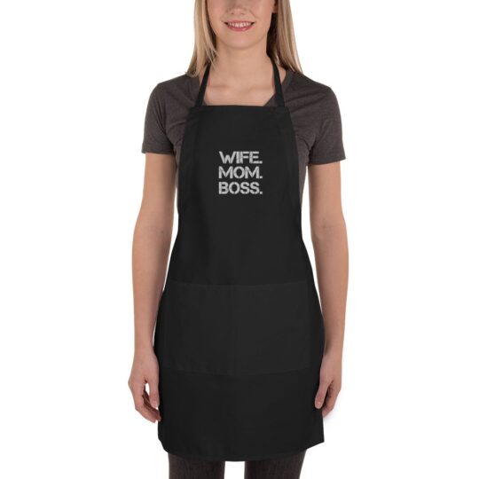 "Wife. Mom. Boss." displayed prominently on the chest area. This apron is designed for the modern woman who proudly plays multiple roles