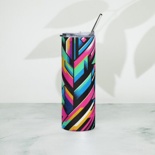 A stainless steel tumbler with a colorful geometric design and a metal straw, positioned on a marble surface with a shadowed background.