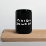 Black Mug with typography, "To be a Rock and not to Roll."